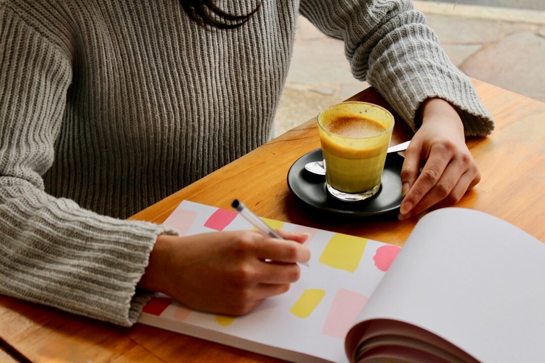 person journaling reflection