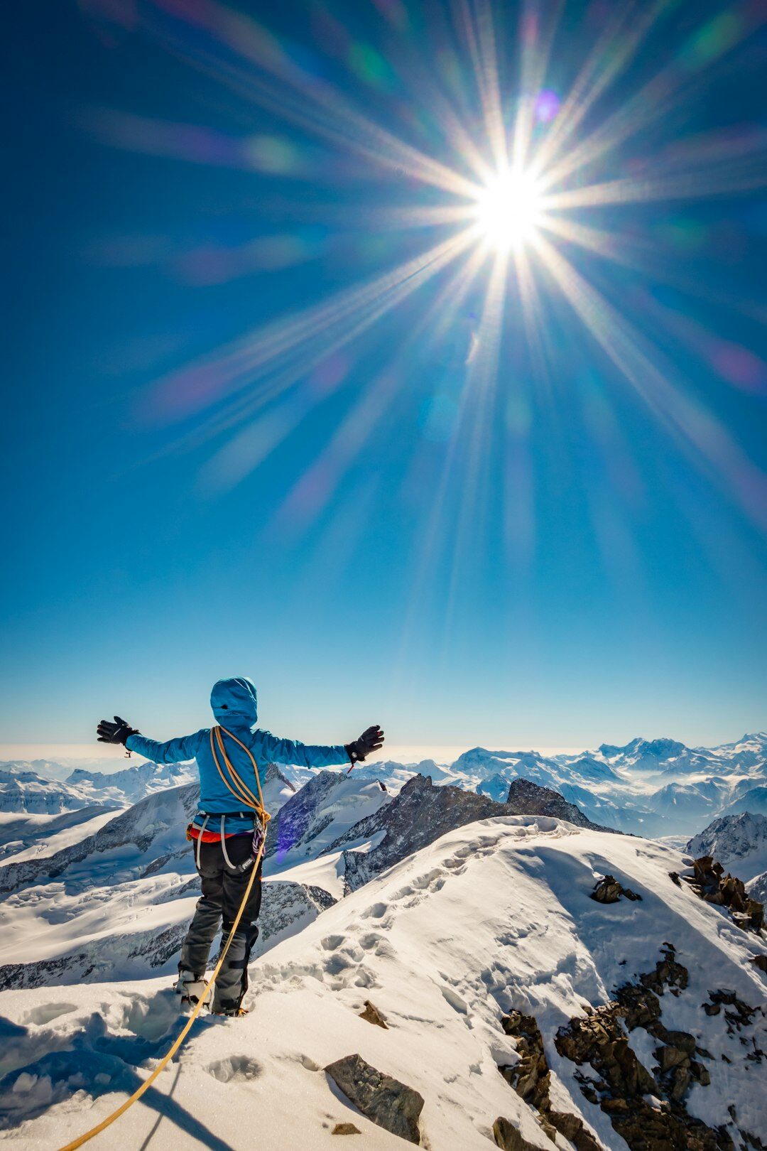 person climbing mountain